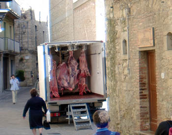 Meat truck delivering to butcher