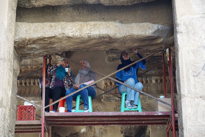 Working on cleaning the Roman frescoes inside the Temple of Luxor